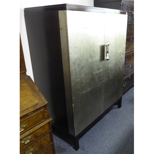 708 - A Baker Furniture Vélez Valet cabinet designed by Bill Sofield (No. 4005); the cabinet is an excepti... 