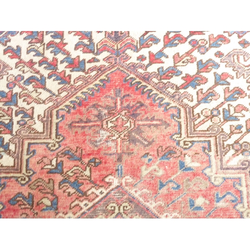 723 - A Heriz carpet; early 20th century, north-west Iran (305cm (10'0