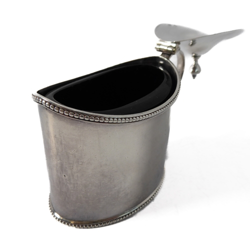 87 - A large hallmarked silver mustard of oval form and with heavy cobalt blue glass liner, maker's mark ... 