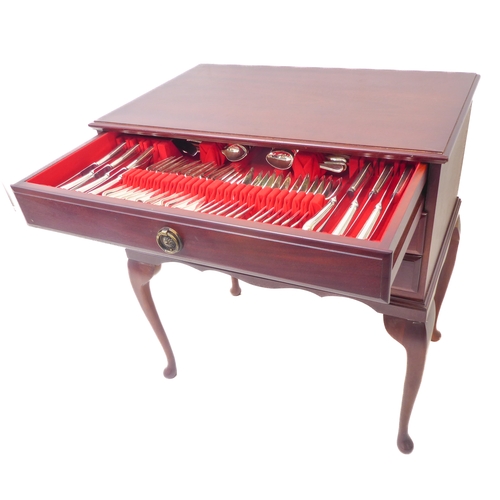 105 - A three-drawer mahogany cutlery/flatware chest raised on cabriole legs. The 12-place silver-plated s... 