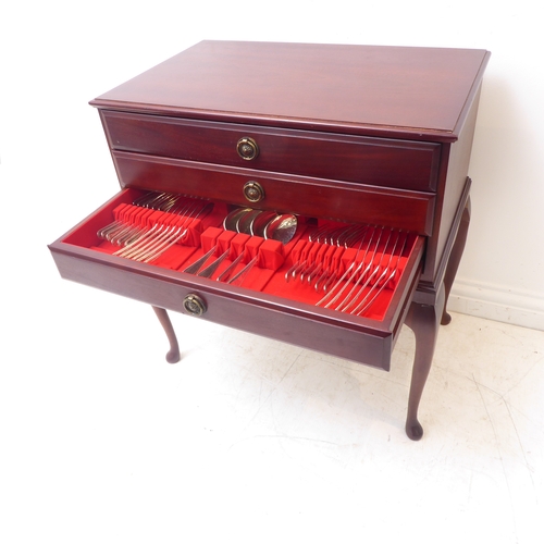 105 - A three-drawer mahogany cutlery/flatware chest raised on cabriole legs. The 12-place silver-plated s... 