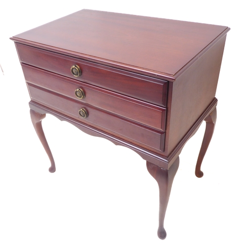 105 - A three-drawer mahogany cutlery/flatware chest raised on cabriole legs. The 12-place silver-plated s... 