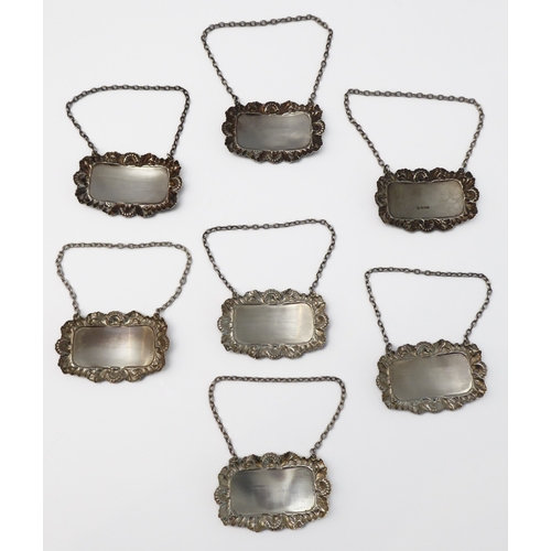 106 - Seven modern hallmarked silver wine/spirit tickets to include Sherry, Martini, Gin, Whiskey, Brandy,... 