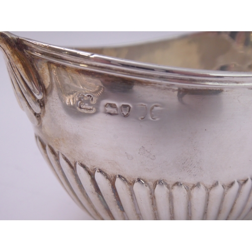 112 - Silverware comprising a heart-shaped trinket dish with raised repoussé-style foliate border and vaca... 