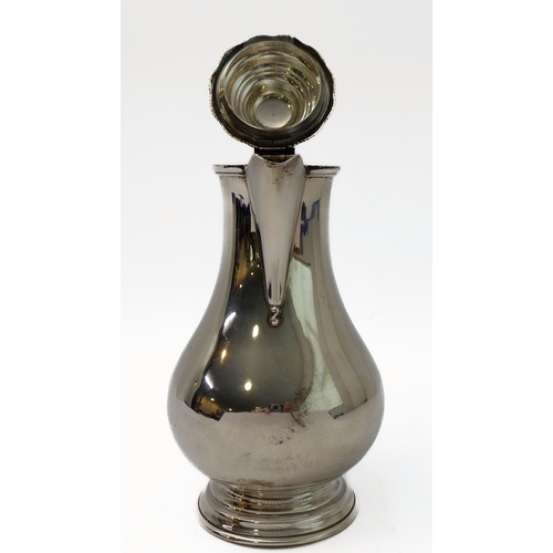 117 - A hallmarked silver hot water jug of baluster form and high arched scrolling ebonised handle, maker'... 