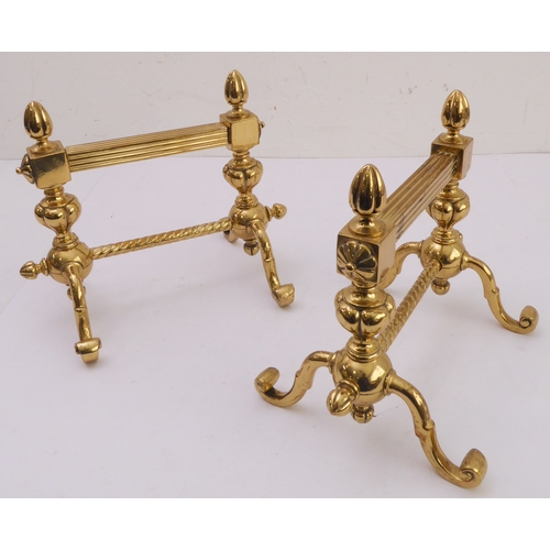 75 - A pair of late 19th century cast and wrought brass andirons (27.5cm wide)