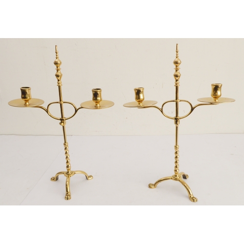 76 - A pair of stylish Arts and Crafts style, height adjustable, two-light candelabra; large circular dri... 