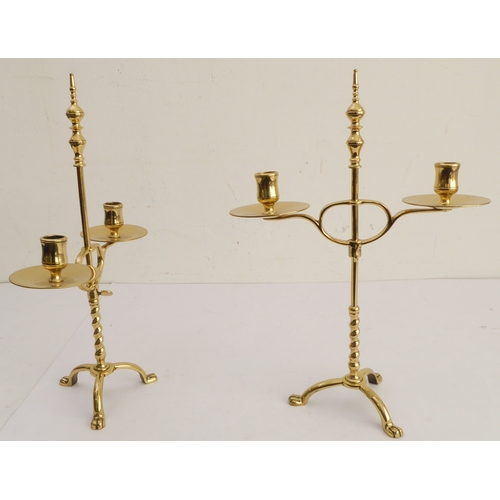 76 - A pair of stylish Arts and Crafts style, height adjustable, two-light candelabra; large circular dri... 