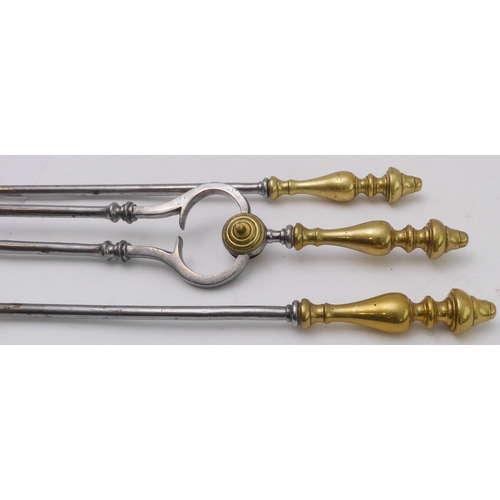 77 - A set of three 19th century steel fireirons comprising pierced shovel, tongs and poker; each with br... 