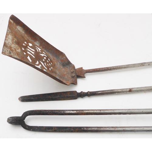 77 - A set of three 19th century steel fireirons comprising pierced shovel, tongs and poker; each with br... 