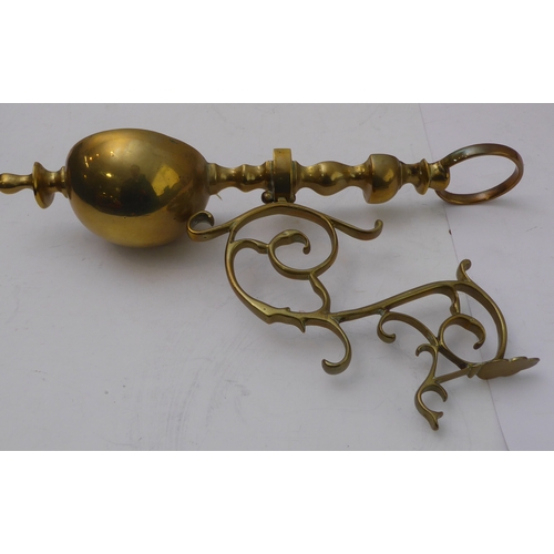 80 - A pair of ceiling-hanging four-light brass candelabra, together with a pair of brass wall appliques ... 