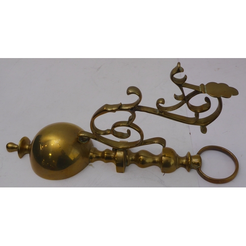 80 - A pair of ceiling-hanging four-light brass candelabra, together with a pair of brass wall appliques ... 