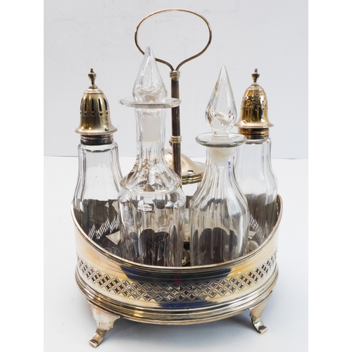93 - A hallmarked silver boat-shaped cruet - five divisions with glass bottles including two castors with... 