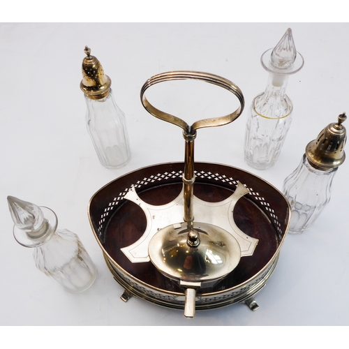 93 - A hallmarked silver boat-shaped cruet - five divisions with glass bottles including two castors with... 