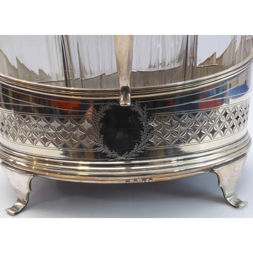 93 - A hallmarked silver boat-shaped cruet - five divisions with glass bottles including two castors with... 