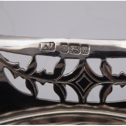 96 - A hallmarked silver bowl; pierced swag style border and raised on three foliate cast feet, maker's m... 