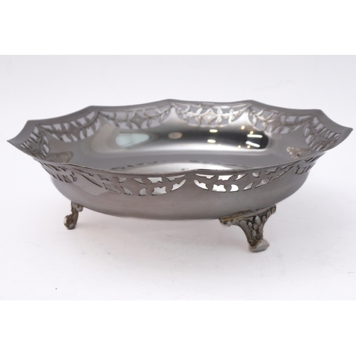 96 - A hallmarked silver bowl; pierced swag style border and raised on three foliate cast feet, maker's m... 