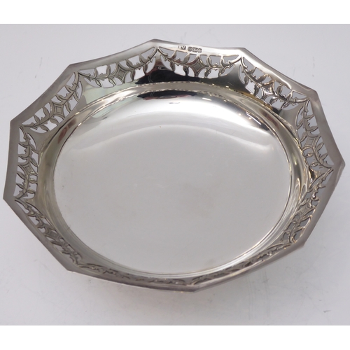 96 - A hallmarked silver bowl; pierced swag style border and raised on three foliate cast feet, maker's m... 