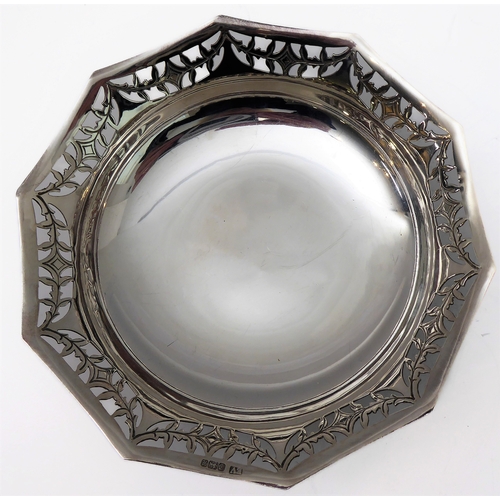 96 - A hallmarked silver bowl; pierced swag style border and raised on three foliate cast feet, maker's m... 