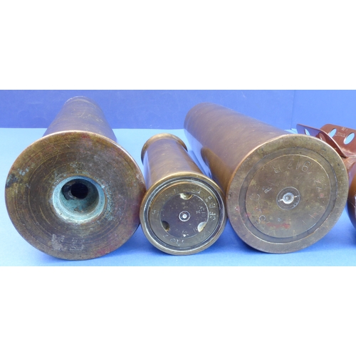 64 - An interesting selection of metalware: 

 - a large WWI Trench Art type brass shell case profusely e... 