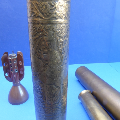 64 - An interesting selection of metalware: 

 - a large WWI Trench Art type brass shell case profusely e... 