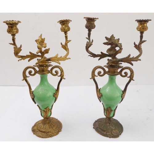 67 - A pair of 19th century gilt-metal-mounted porcelain two-light table candelabra: in the Louis XV tast... 
