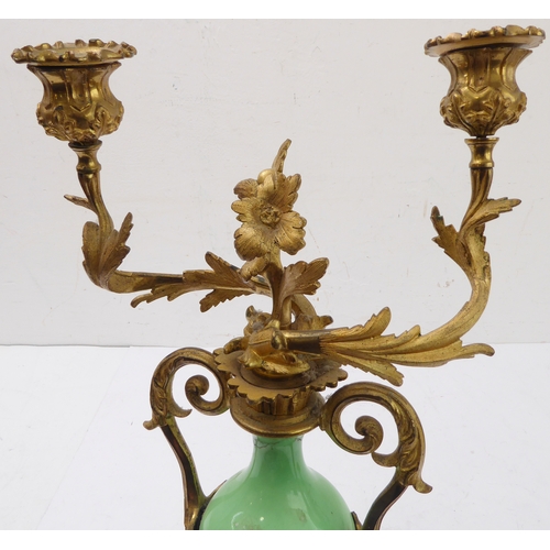 67 - A pair of 19th century gilt-metal-mounted porcelain two-light table candelabra: in the Louis XV tast... 