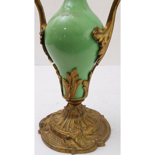 67 - A pair of 19th century gilt-metal-mounted porcelain two-light table candelabra: in the Louis XV tast... 