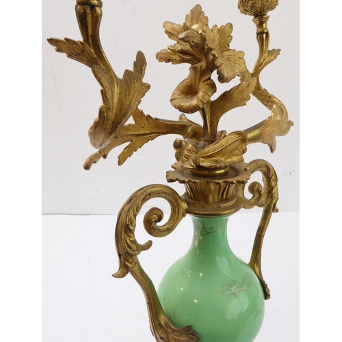 67 - A pair of 19th century gilt-metal-mounted porcelain two-light table candelabra: in the Louis XV tast... 