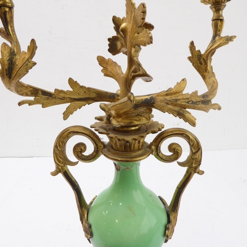67 - A pair of 19th century gilt-metal-mounted porcelain two-light table candelabra: in the Louis XV tast... 
