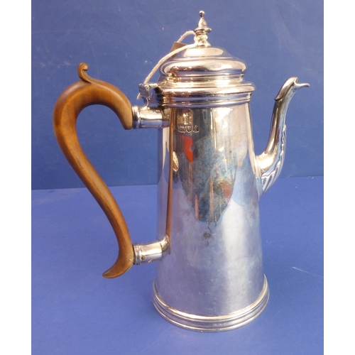 86 - A heavy hallmarked silver coffee pot of circular conical form  high-arched scrolling wooden handle ... 