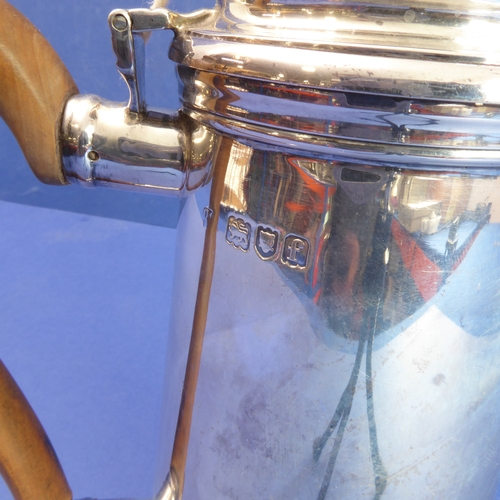 86 - A heavy hallmarked silver coffee pot of circular conical form  high-arched scrolling wooden handle ... 