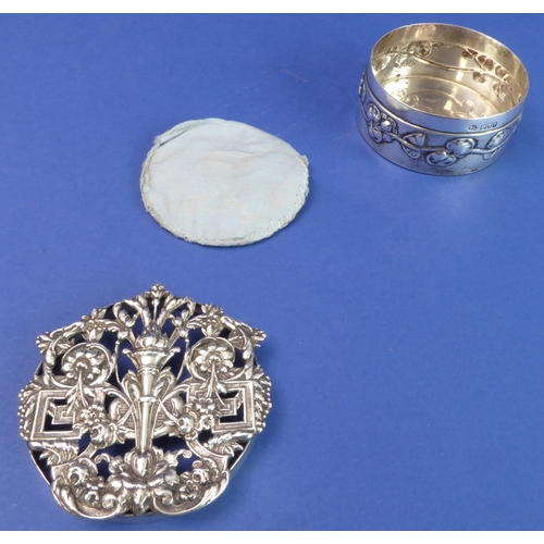 91 - A circular hallmarked silver trinket/silver jewellery box; the elaborately decorated and pierced cov... 