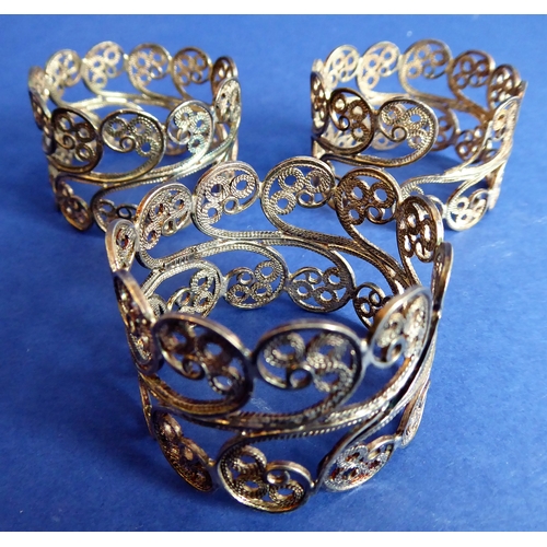 119 - Three filigree-style napkin rings marked '1000', a lady's late 19th / early 20th century silver-hand... 