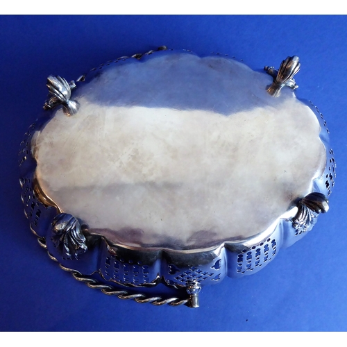 120 - A heavy hallmarked silver cake basket  rope-twist-style swing-handle above a castellated-style pier... 