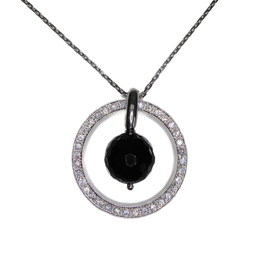 104 - An unusual circular silver pendant set with hand-cut white stones, faceted black dropper with suspen... 