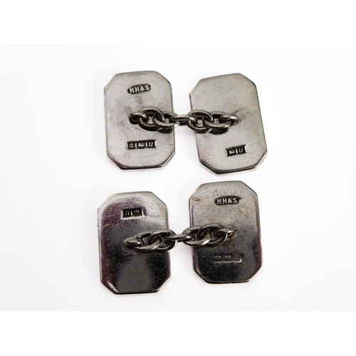 109 - A pair of gentleman's heavy hallmarked octagonal silver cufflinks: one side with engine-turned decor... 