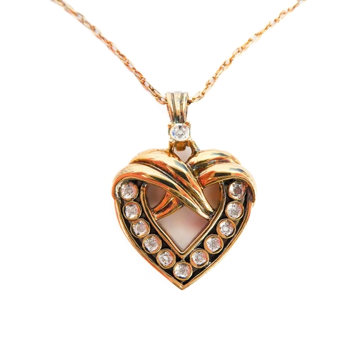 110 - A lady's heavy silver gilt heart-shaped crossover style pendant mounted with twelve diamonds (the re... 