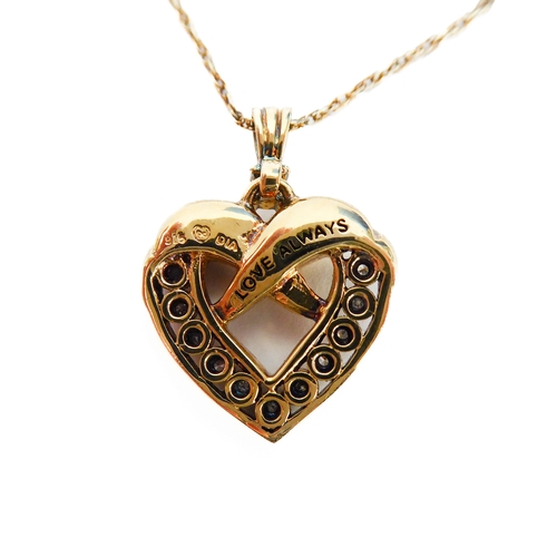 110 - A lady's heavy silver gilt heart-shaped crossover style pendant mounted with twelve diamonds (the re... 