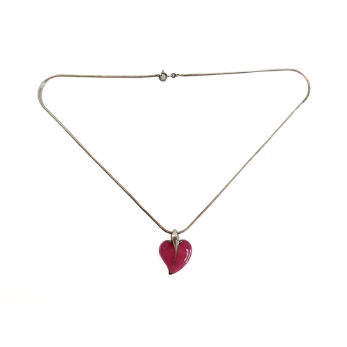 112 - A silver pendant mounted with a polished hardstone as a heart, upon a silver neck chain (boxed)