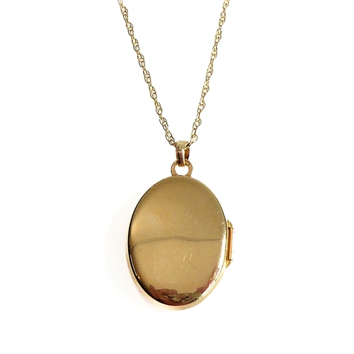 115 - A 9-carat yellow gold floral engraved pendant on a 9-carat gold chain