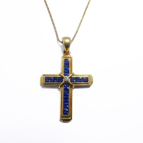 116 - A 18-carat gold, sapphire and diamond cross with an 18-carat gold chain