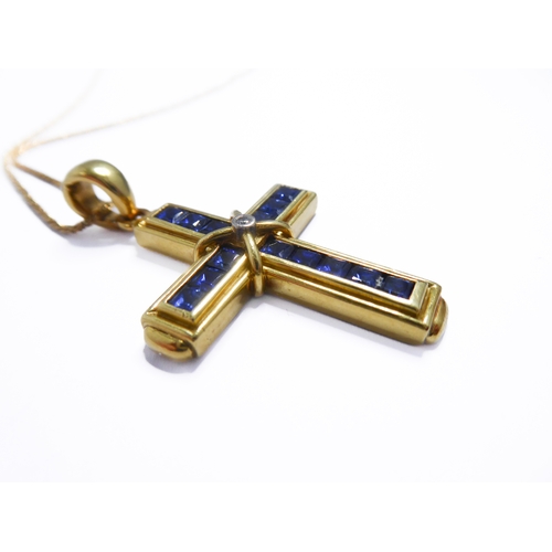 116 - A 18-carat gold, sapphire and diamond cross with an 18-carat gold chain