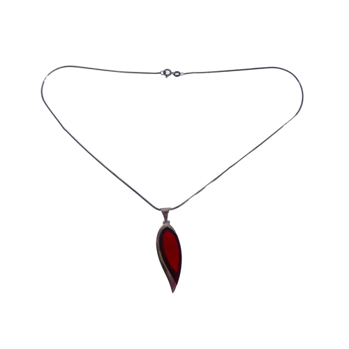 117 - An unusual silver mounted and red hardstone inverted teardrop-shaped pendant upon a silver chain, in... 