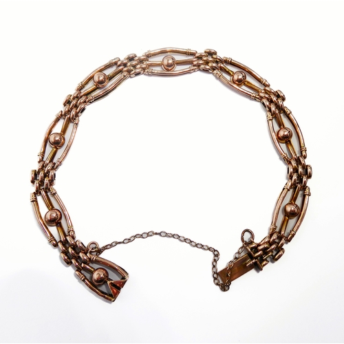 119 - A 9-carat gold gate-style bracelet with safety chain