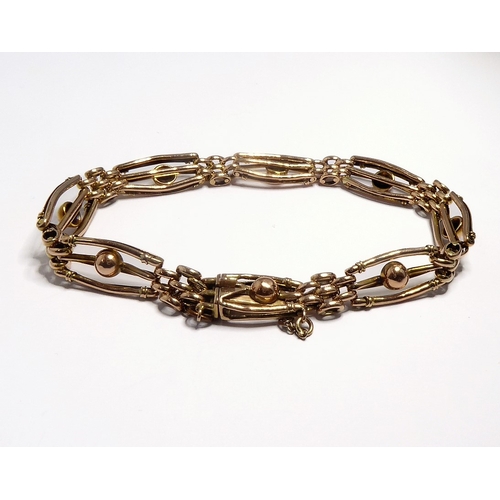 119 - A 9-carat gold gate-style bracelet with safety chain