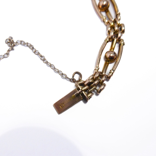 119 - A 9-carat gold gate-style bracelet with safety chain