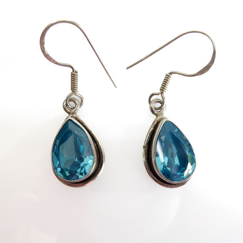 133 - A pair of lady's boxed teardrop-shaped silver earrings: each mounted with a hand-cut aquamarine-styl... 