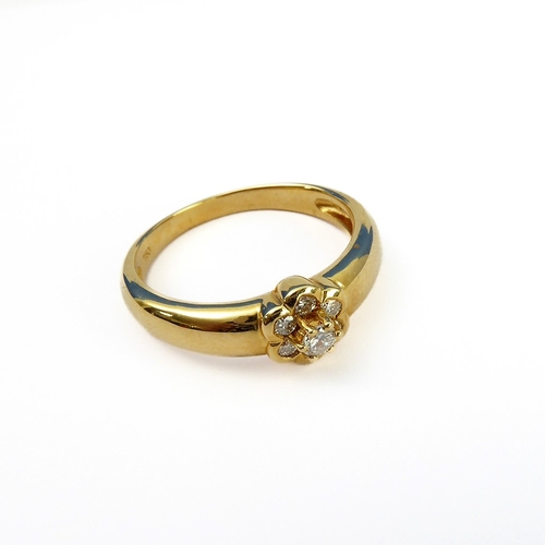 135 - An 18-carat gold seven diamond cluster ring, ring size P/Q