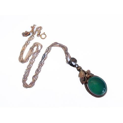 137 - A silver pendant mounted with a green hardstone polished en cabochon, upon a silver chain (boxed)